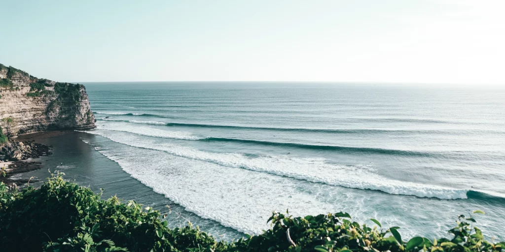 An image of the Uluwatu beach focused on the waves and ocean.